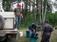 Denis filling a garbage pail with water prior to transferring fish from the Hatchery truck.